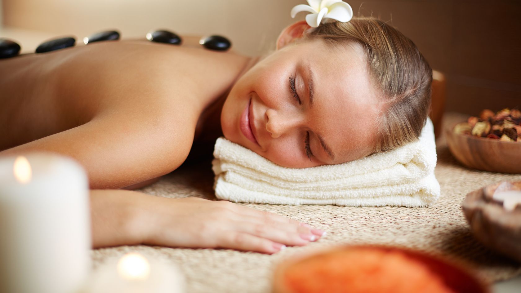 A woman getting a back massage at a spa