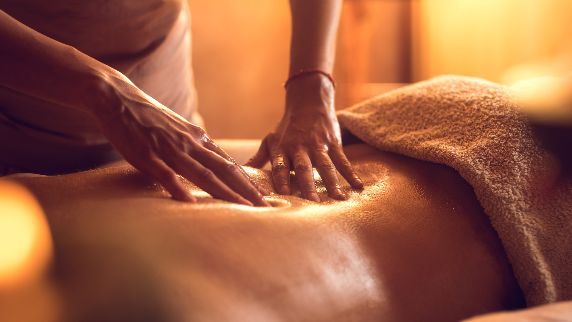 A woman getting a back massage at a spa